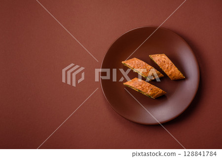Roll of omelette, spinach, cheese and minced meat Roll of omelette, spinach, cheese and minced meat 128841784