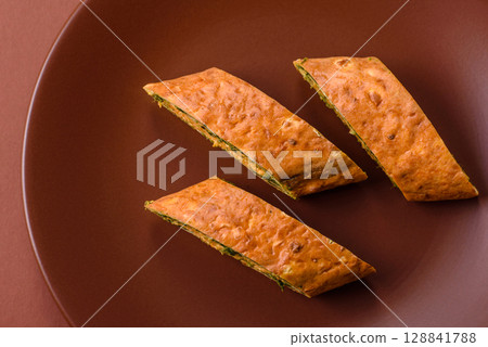 Roll of omelette, spinach, cheese and minced meat Roll of omelette, spinach, cheese and minced meat 128841788
