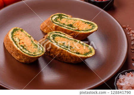 Roll of omelette, spinach, cheese and minced meat Roll of omelette, spinach, cheese and minced meat 128841790