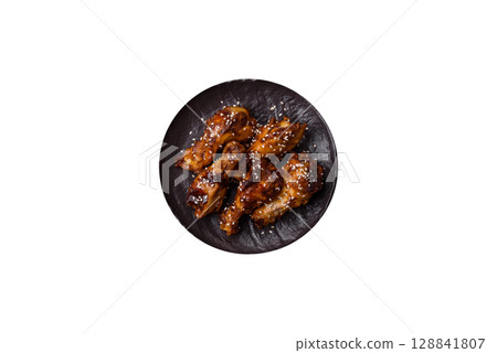 Grilled chicken wings in teriyaki sauce. Hot spicy takeaway food Grilled chicken wings in teriyaki sauce. Hot spicy takeaway food 128841807
