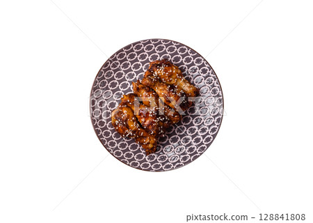 Grilled chicken wings in teriyaki sauce. Hot spicy takeaway food 128841808