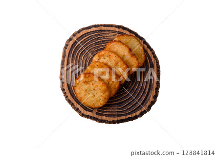Potato hash browns, a meal with onions, cabbage in the form of fritters Potato hash browns, a meal with onions, cabbage in the form of fritters 128841814