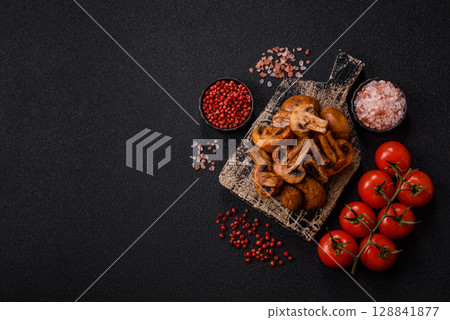 Food, baked mushrooms champignon slices with sauce and spices Food, baked mushrooms champignon slices with sauce and spices 128841877