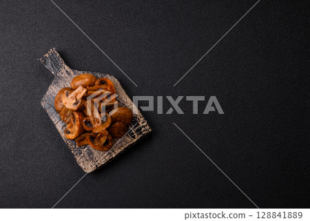 Food, baked mushrooms champignon slices with sauce and spices Food, baked mushrooms champignon slices with sauce and spices 128841889