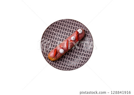 French food, dessert eclair with chocolate filling. Eclair as a background 128841916