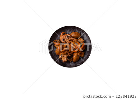 Food, baked mushrooms champignon slices with sauce and spices Food, baked mushrooms champignon slices with sauce and spices 128841922