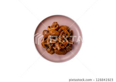 Food, baked mushrooms champignon slices with sauce and spices Food, baked mushrooms champignon slices with sauce and spices 128841923