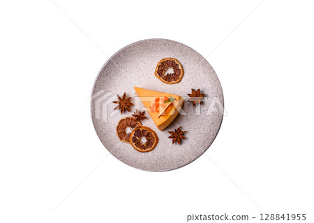 A slice of yellow cheesecake cake flavored with lemon and passion fruit A slice of yellow cheesecake cake flavored with lemon and passion fruit 128841955