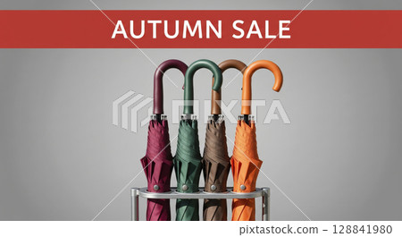 "Autumn Sale" text over colorful closed umbrellas. Seasonal shopping and weather protection deals. 128841980