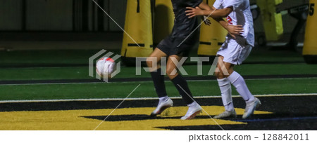 Exciting Soccer Match Between Teams Under Night Lights 128842011