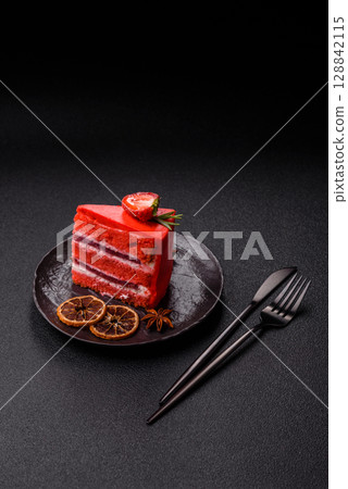 A piece of red velvet cake as a food background. Sweet pastries for celebration A piece of red velvet cake as a food background. Sweet pastries for celebration 128842115
