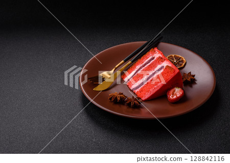 A piece of red velvet cake as a food background. Sweet pastries for celebration A piece of red velvet cake as a food background. Sweet pastries for celebration 128842116