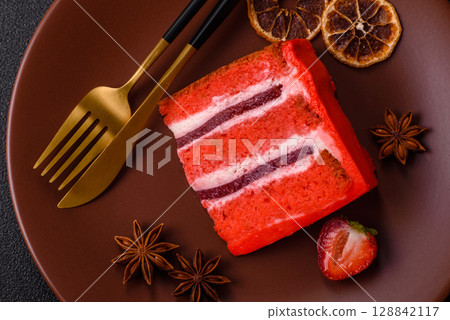 A piece of red velvet cake as a food background. Sweet pastries for celebration A piece of red velvet cake as a food background. Sweet pastries for celebration 128842117
