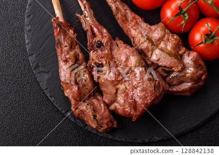 Juicy meat on the bone or rack of lamb. Grilled veal with salt, spices and herbs Juicy meat on the bone or rack of lamb. Grilled veal with salt, spices and herbs 128842138