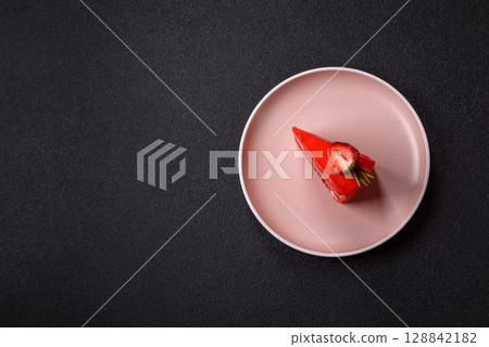 A piece of red velvet cake as a food background. Sweet pastries for celebration 128842182