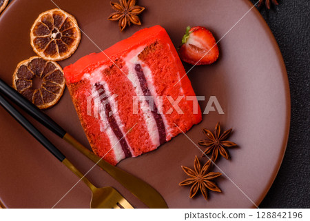A piece of red velvet cake as a food background. Sweet pastries for celebration A piece of red velvet cake as a food background. Sweet pastries for celebration 128842196