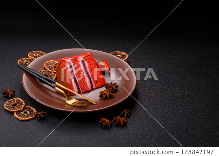 A piece of red velvet cake as a food background. Sweet pastries for celebration A piece of red velvet cake as a food background. Sweet pastries for celebration 128842197