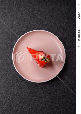 A piece of red velvet cake as a food background. Sweet pastries for celebration A piece of red velvet cake as a food background. Sweet pastries for celebration 128842208