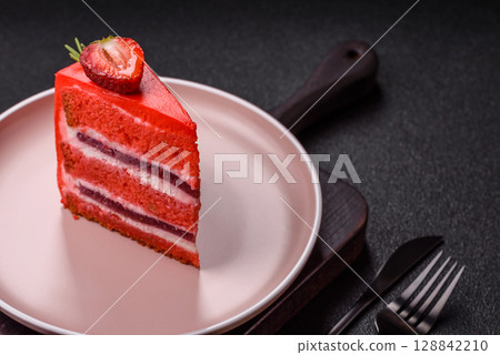 A piece of red velvet cake as a food background. Sweet pastries for celebration A piece of red velvet cake as a food background. Sweet pastries for celebration 128842210
