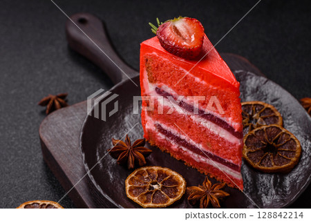A piece of red velvet cake as a food background. Sweet pastries for celebration A piece of red velvet cake as a food background. Sweet pastries for celebration 128842214