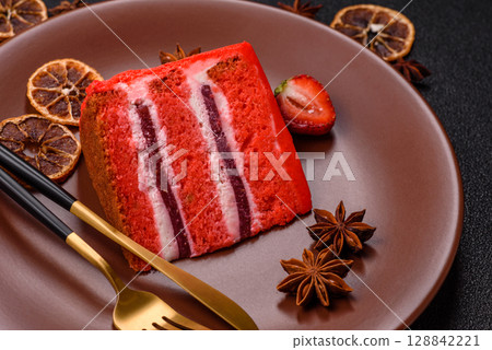 A piece of red velvet cake as a food background. Sweet pastries for celebration 128842221
