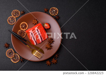 A piece of red velvet cake as a food background. Sweet pastries for celebration A piece of red velvet cake as a food background. Sweet pastries for celebration 128842223