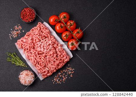 Raw ground beef or pork as an ingredient for burgers. Raw minced meat Raw ground beef or pork as an ingredient for burgers. Raw minced meat 128842440