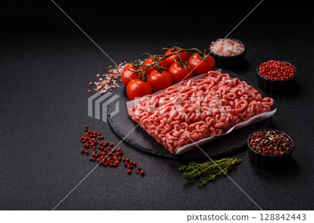 Raw ground beef or pork as an ingredient for burgers. Raw minced meat Raw ground beef or pork as an ingredient for burgers. Raw minced meat 128842443