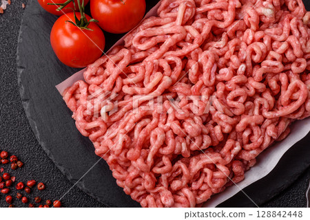 Raw ground beef or pork as an ingredient for burgers. Raw minced meat Raw ground beef or pork as an ingredient for burgers. Raw minced meat 128842448