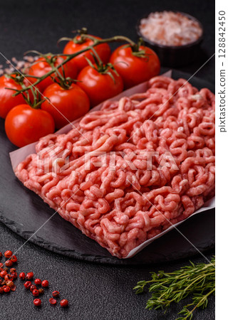 Raw ground beef or pork as an ingredient for burgers. Raw minced meat 128842450