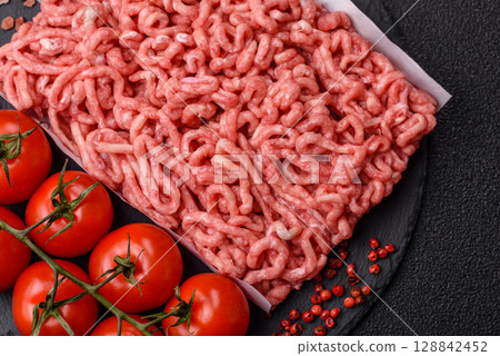 Raw ground beef or pork as an ingredient for burgers. Raw minced meat 128842452