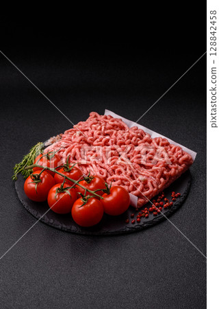 Raw ground beef or pork as an ingredient for burgers. Raw minced meat Raw ground beef or pork as an ingredient for burgers. Raw minced meat 128842458