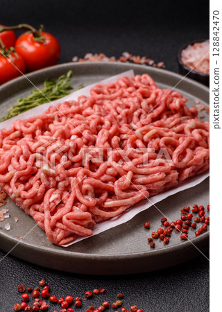Raw ground beef or pork as an ingredient for burgers. Raw minced meat 128842470