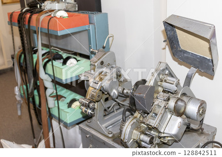 Shot of the vintage, old, obsolete movie film projector. Retro 128842511