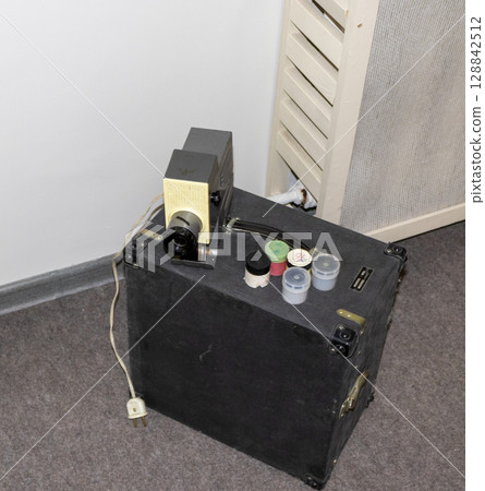 Shot of the vintage, old, obsolete movie film projector. Retro 128842512
