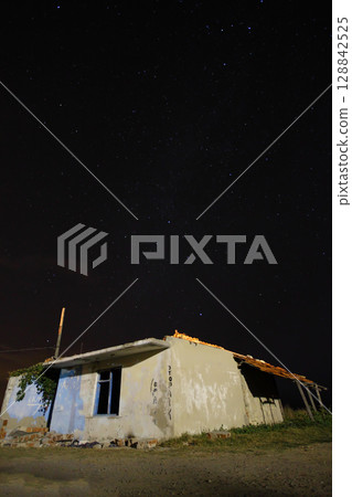 A view of the stars of the Milky Way with a mountain top in the foreground.Perseid Meteor Shower observation A view of the stars of the Milky Way with a mountain top in the foreground.Perseid Meteor Shower observation 128842525