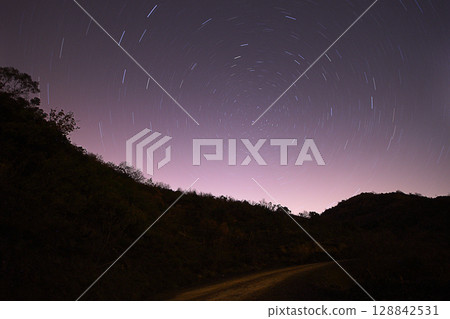 A view of the stars of the Milky Way with a mountain top in the foreground.Perseid Meteor Shower observation A view of the stars of the Milky Way with a mountain top in the foreground.Perseid Meteor Shower observation 128842531