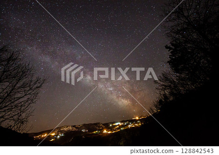 A view of the stars of the Milky Way with a mountain top in the foreground.Perseid Meteor Shower observation 128842543