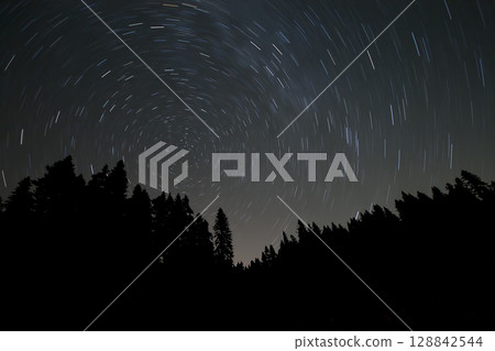 A view of the stars of the Milky Way with a mountain top in the foreground.Perseid Meteor Shower observation 128842544