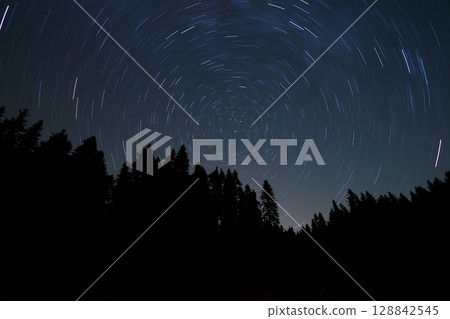 A view of the stars of the Milky Way with a mountain top in the foreground.Perseid Meteor Shower observation 128842545