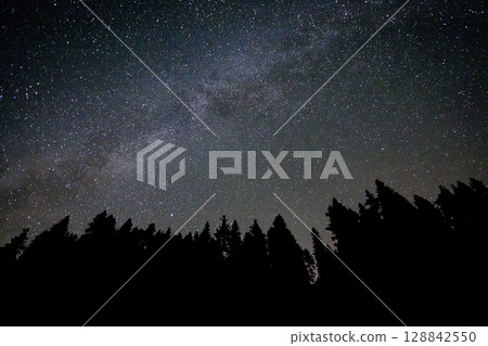 A view of the stars of the Milky Way with a mountain top in the foreground.Perseid Meteor Shower observation A view of the stars of the Milky Way with a mountain top in the foreground.Perseid Meteor Shower observation 128842550