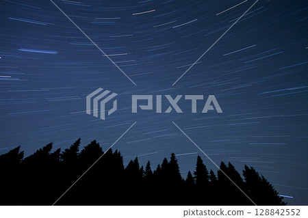 A view of the stars of the Milky Way with a mountain top in the foreground.Perseid Meteor Shower observation 128842552