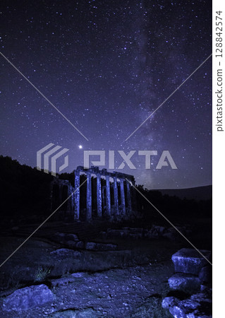 A view of the stars of the Milky Way with a mountain top in the foreground.Perseid Meteor Shower observation 128842574