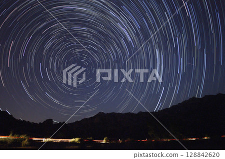 A view of the stars of the Milky Way with a mountain top in the foreground.Perseid Meteor Shower observation A view of the stars of the Milky Way with a mountain top in the foreground.Perseid Meteor Shower observation 128842620
