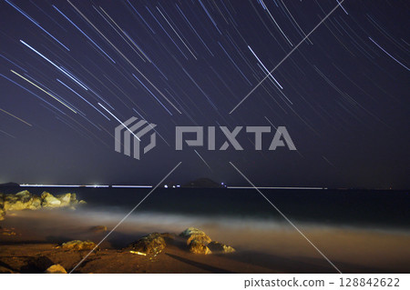 A view of the stars of the Milky Way with a mountain top in the foreground.Perseid Meteor Shower observation 128842622