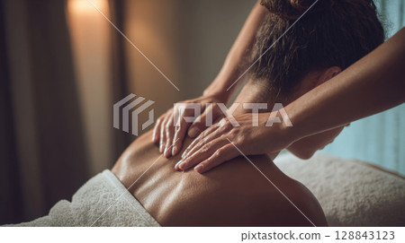 Professional back massage, designed to melt away tension, promote profound relaxation. Symbol of tranquility, self-care, perfect for showcasing wellness, spa treatments, art of pampering. 128843123