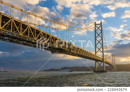 Sunset at Akashi Kaikyo Bridge, one of the world's largest suspension bridges 128843674