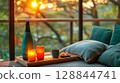 Ceramic sake bottle and cups on wooden tray with sushi, minimal luxury style and soft warm light 128844741