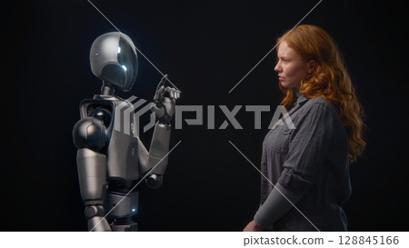 Human-Machine Concept: Visualization of Young Woman Speaking with High-Tech Humanoid Robot Human-Machine Concept: Visualization of Young Woman Speaking with High-Tech Humanoid Robot 128845166