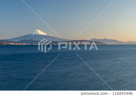 Mount Fuji, Nihon-daira, and Mount Aitaka seen from Ishizuhama in Yaizu, enveloped in morning silence 128845996